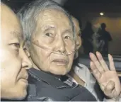  ?? ?? Peru’s former president Alberto Fujimori sits between his children upon his release from prison last December. PHOTO: RENATO PAJUELO/AFP