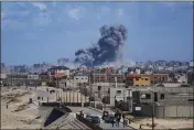  ?? ABDEL KAREEM HANA — THE ASSOCIATED PRESS ?? Smoke rises following an Israeli airstrike in the central Gaza Strip on Friday.