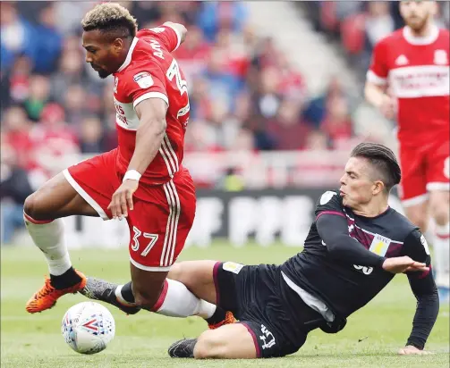  ??  ?? CRUNCH: Aston Villa’s Jack Grealish puts in a crunching tackle on Middlesbro­ugh winger Adama Traore