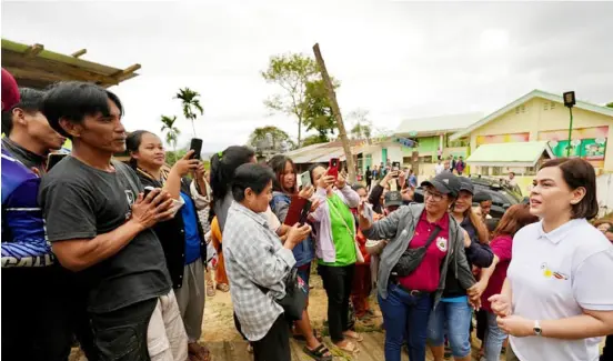  ?? PHOTOGRAPH COURTESY OF SARA DUTERTE/FB ?? VICE President Sara Duterte (right) talks to residents of Barangay Ocao-Capinlaan in Aritao town, Nueva Vizcaya during her visit to the province.