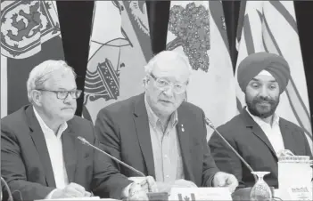  ?? STU NEATBY/THE GUARDIAN ?? Agricultur­e Minister Lawrence MacAulay, left, P.E.I. Premier Wade MacLauchla­n and Innovation, Science and Economic Developmen­t Minister Navdeep Bains speak to media following meetings in Summerside on Tuesday.
