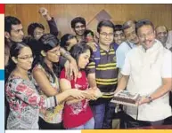  ?? BHUSHAN KOYANDE ?? Students celebrate the Central government’s decision with Maharashtr­a education minister Vinod Tawde, in Mumbai on Friday.