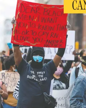  ?? CARLOS OSORIO / REUTERS ?? Protesters march in downtown Toronto on Saturday to highlight a police-involved death in the city. The rally was organized by a group called Not Another Black Life.