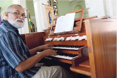  ??  ?? Dwight McBean plays the pipe organ at the Kingston Parish Church, South Parade, Kingston.