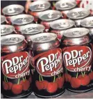  ?? ETHAN MILLER/GETTY IMAGES ?? Shares of Dr Pepper Snapple surged more than 22% Monday, closing at $117.07.