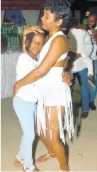  ??  ?? Tawani Connell dances with her daughter, Arya Headley, at the Negril Internatio­nal Food and Wine event last Saturday night at the Boardwalk Village in Negril.