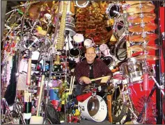  ??  ?? Religious cymbals: Dr Mark Temperato and his impressive 813-piece drum kit