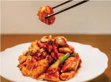  ?? ?? The well-known Sichuan Kung Pao Chicken, identifiab­le by its spiciness fuelled by dried chillies, but pleasantly tempered down with vinegar, soy and sugar.