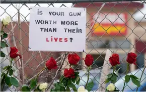  ?? AP ?? A sign outside the grocery store in Boulder, Colorado, where 10 people died in a mass shooting last week.