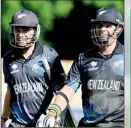 ??  ?? New Zealand's Tim Southee (L) and Mitchell McClenagha­n walk off the field after defeating Sri Lanka
– REUTERS