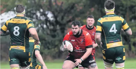  ?? Sharon McLean ?? Arnie Haydock looks to make yards for Widnes in the clash with West Park last Saturday.