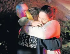  ?? Picture: REUTERS ?? SEEKING SOLACE: People comfort each other after the mass shooting in Los Angeles