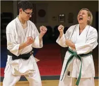  ??  ?? Griffith plays around with his mom and fellow student, Holly Griffith, at Dao-Ichi Shotokan Karate-Do.