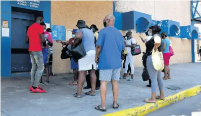  ?? FILE ?? In this March 2021 photo, people are seen waiting at the Kingston Public Hospital.