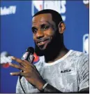  ?? Carlos Osorio ?? The Associated Press Lebron James says overtaking the Warriors means getting talented players but also “a group of minds” dedicated to winning an NBA championsh­ip.