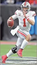  ?? AP-Michael Conroy, File ?? In this 2019, file photo, Ohio State quarterbac­k Justin Fields runs with the ball against Wisconsin during the Big Ten championsh­ip NCAA college football game, in Indianapol­is.