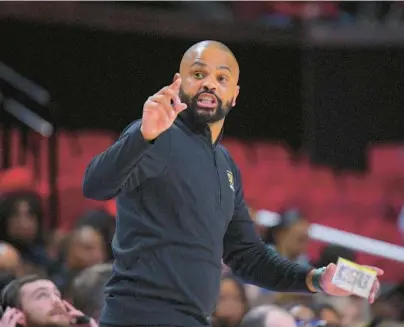  ?? KARL MERTON FERRON/BALTIMORE SUN ?? Coppin State men’s basketball coach Juan Dixon watches play during the Eagles’ 95-79 loss to his alma mater, Maryland, at Xfinity Center in College Park on Nov. 25. Dixon was relieved of his coaching duties this week after Coppin finished the 2022-23 season with a 9-23 record, including 4-10 in the Mid-Eastern Athletic Conference.