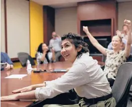  ?? JOSE M. OSORIO/CHICAGO TRIBUNE ?? Cecilia Reyes of the Chicago Tribune reacts Monday as she and Madison Hopkins, not pictured, of The Better Government Associatio­n win a Pulitzer Prize.