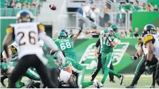  ?? BRANDON HARDER ?? Roughrider­s quarterbac­k Brandon Bridge shared passing duties with David Watford in Thursday’s game against the Tiger-Cats.