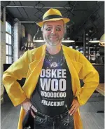  ?? ?? Tiger-Cats fan and season ticket holder Wally Walker of Hamilton is decked out in his Dick Tracy yellow at the Spirit of Edmonton party at Industria Pizza and Bar on John Street.