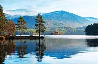  ??  ?? ISLAND CASTLE: Swimmers can reach the 14th Century ruins in Loch an Eilein in the Cairngorms. Below: Blea Tarn in the Lakes. Left: Lady Falls in the Brecon Beacons