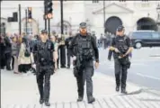  ?? REUTERS ?? Armed police officers on a patrol Westminste­r in London.