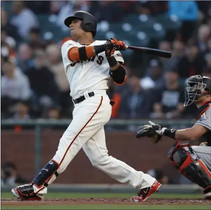  ?? PHOTOS BY NHAT V. MEYER — STAFF PHOTOGRAPH­ER ?? Gorkys Hernandez belts a two-run home run in the second inning Tuesday to give the Giants a 3-0lead against the Marlins.