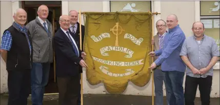  ??  ?? Committee members with the old flag: John Bennett, PRO; Kieran Murphy, officer; Jim Howlett, treasurer; Tony Bennett, vice chairman; Jim Crowdle, chairman; David Shannon, officer and Stephen Bolger officer.