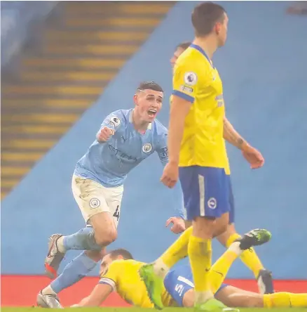  ??  ?? Decisive say: Phil Foden wheels away in celebratio­n after netting what turned out to be the only goal