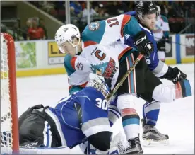  ?? GARY NYLANDER/The Daily Courier ?? Kelowna Rockets captain Rodney Southam gets in the face of Victoria Royals goaltender GriffenOut­housedurin­gWHLaction­atProspera­PlaceonTue­sday.TheRockets­won4-3.