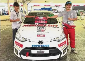  ??  ?? Kenneth (right) with his father Hong Nam and the Vios race car.