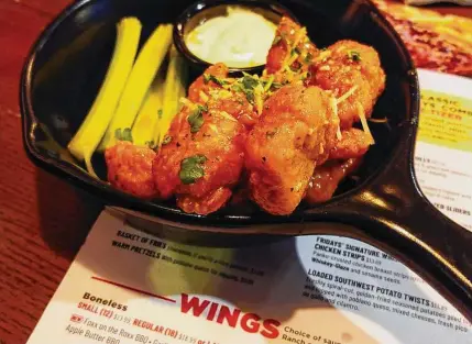  ?? Matt Rourke/Associated Press ?? An order of “boneless chicken wings” is shown at a restaurant in Willow Grove, Pa., on Wednesday.