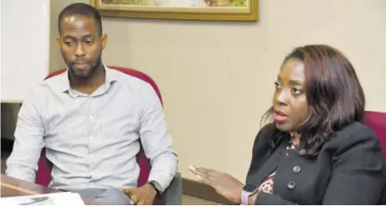  ?? (Photo: Karl Mclarty) ?? Technical coordinato­r of intermedia­ry relations for the BIGEE Programme at Developmen­t Bank of Jamaica (DBJ) Limited Natalie D’oyen makes a point during a Jamaica Observer Business Forum at the DBJ’S office on Oxford Road in the Corporate Area. BIGEE Programme Manager Christophe­r Brown looks on.