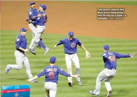  ?? | GENE J. PUSKAR/ AP ?? Cubs players celebrate their World Series championsh­ip after the final out of Game 7 in Cleveland.