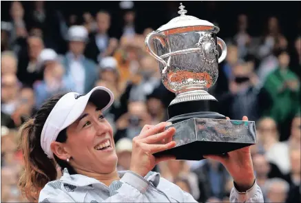  ?? Picture: Associated Press ?? GOLDEN GIRL: Spain’s Garbine Muguruza with the French Open trophy after beating American Serena Williams in yesterday’s final at Roland Garros in Paris.