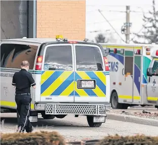  ?? POSTMEDIA NEWS ?? Alberta Health Services ambulances and paramedics were photograph­ed at the Peter Lougheed Centre in Calgary on Jan. 17.