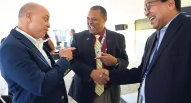  ?? GLADSTONE TAYLOR/PHOTOGRAPH­ER ?? From left: Jamaica Producers chief executive officer (CEO) Jeffrey Hall; Airports Authority of Jamaica President, Audley Deidrick; and Kingston Wharves Limited CEO Grantley Stephenson are quite animated at the Kingston Wharves Limited official...