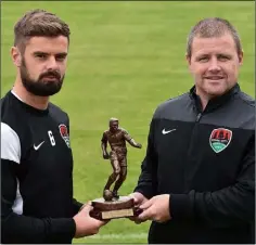  ??  ?? Greg Bolger receives his award from John Cotter, Cork City coach.