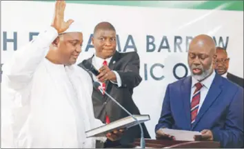  ?? — AFP ?? Senegalese president Adama Barrow being sworn in as president of Gambia at the Gambian Embassy in Dakar on January 19, 2017.