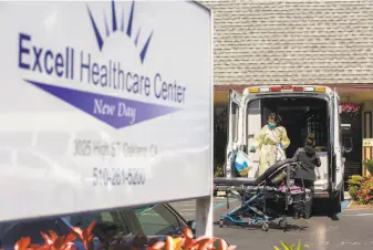  ?? Santiago Mejia / The Chronicle ?? Two emergency medical technician­s disinfect the ambulance after transporti­ng a patient to Excell Health Care Center nursing home in Oakland, where some residents died of COVID19.
