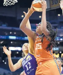  ?? ASHLEY LANDIS/AP ?? Connecticu­t Sun forward Jonquel Jones shoots over Los Angeles Sparks forward Nia Coffey during a Sept. 9 game in Los Angeles. Jones is our pick for league MVP.