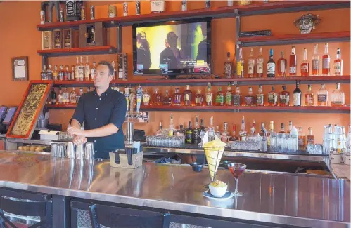  ?? GREG SORBER/JOURNAL ?? Bartender Channing Hofman tends the new bourbon bar at Zacatecas Tacos + Tequila + Bourbon.