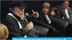  ?? — AP ?? Author and film producer George RR Martin, left, speaks in Santa Fe.