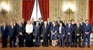  ??  ?? Mattarella poses with newly appointed Ministers after the sworn-in ceremony at the Quirinal palace in Rome. — Reuters photo