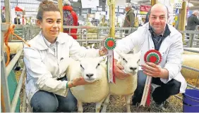  ??  ?? > Supreme Interbreed Sheep Champions, with Hywel and Carwen Williams