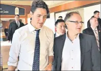  ?? FACEBOOK.COM/WAYNELONG ?? Saint John–Rothesay Liberal MP Wayne Long, right, broke ranks with his party on tax reform and was removed from two Commons committees for his trouble by Prime Minister Justin Trudeau, left.