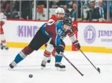  ?? John Leyba, The Denver Post ?? Avalanche left wing Gabe Landeskog, working against Carolina’s Josh Jooris this season, will sit out four games for cross checking Calgary’s Matthew Tkachuk on Saturday.