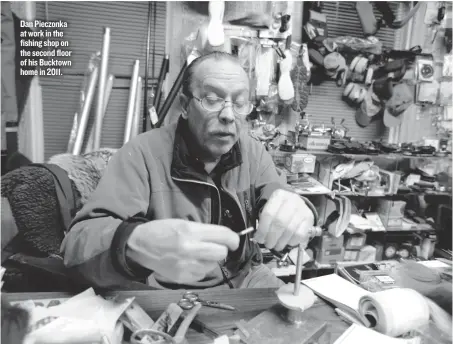  ??  ?? Dan Pieczonka at work in the fishing shop on the second floor of his Bucktown home in 2011.