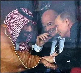  ??  ?? Power posse: Crown Prince Mohammed, Fifa’s Gianni Infantino and Vladimir Putin