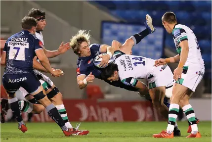  ??  ?? ■ Sale Sharks scrum half Faf de Klerk is upended by Newcastle wing Mateo Carreras. Below, Falcons boss Dean Richards